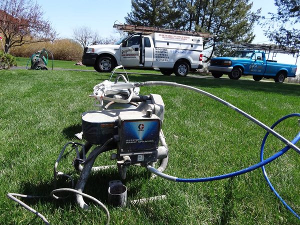 Paint sprayer set up on a lawn